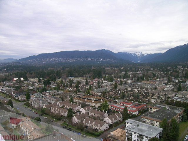 Spacious 2-bedroom + den condo with a stunning city view, featuring modern furnishings and a cozy den.