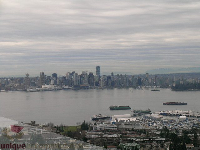 Spacious 2-bedroom + den condo with stunning city view, featuring modern furnishings and a cozy den.