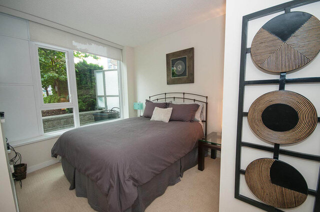 Spacious 1-bedroom + den with large windows, modern decor, and a cozy bed setup. - 903 - 821 Cambie Street, Vancouver Downtown