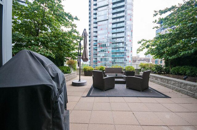 Spacious rooftop patio with modern furniture, city views, and a covered grill. - 903 - 821 Cambie Street, Vancouver Downtown