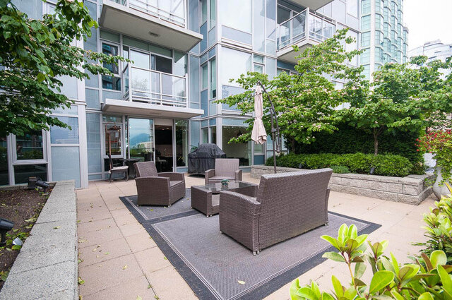 Spacious patio with modern furniture and lush greenery, perfect for relaxation. - 903 - 821 Cambie Street, Vancouver Downtown