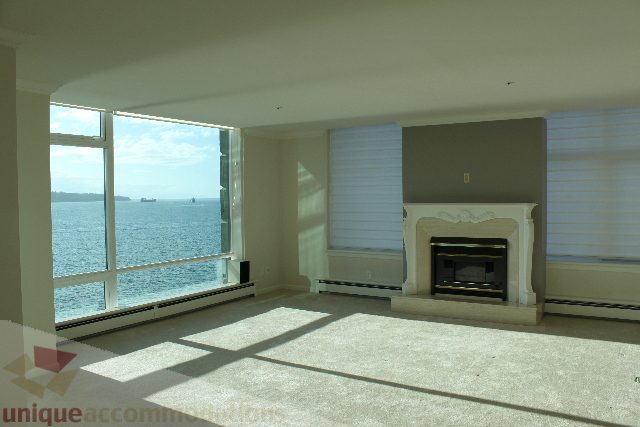 Furnished living room with hardwood floors and a city view. - 900 - 1919 Beach Ave, Vancouver Downtown