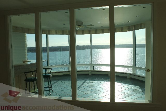 Furnished living room with large windows offering a stunning city view. - 900 - 1919 Beach Ave, Vancouver Downtown