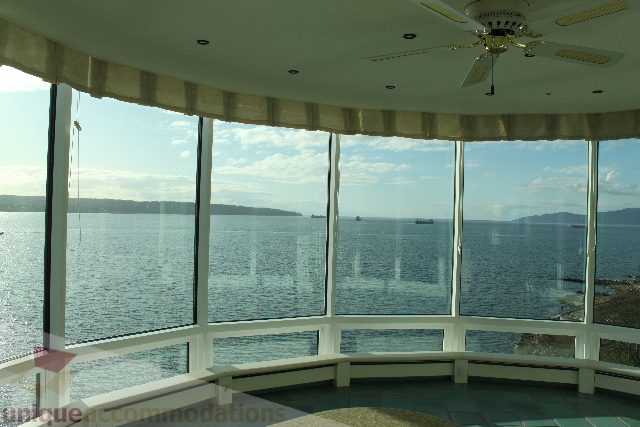 Furnished living room with expansive city view and large windows. - 900 - 1919 Beach Ave, Vancouver Downtown