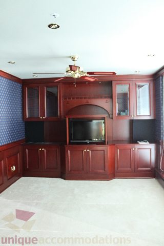 Living room with wooden cabinets and a flat-screen TV. - 900 - 1919 Beach Ave, Vancouver Downtown