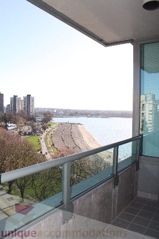 Bright living room with city view and modern furnishings. - 900 - 1919 Beach Ave, Vancouver Downtown