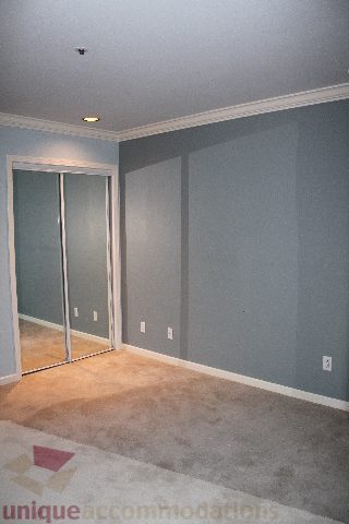 Den with sliding glass doors and carpeted floor. - 900 - 1919 Beach Ave, Vancouver Downtown