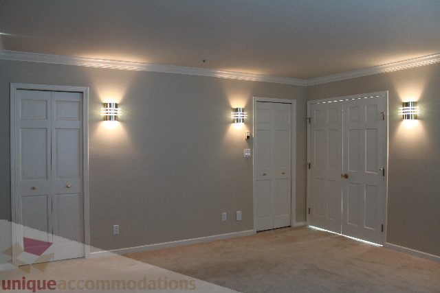 Bright entryway with double doors and modern wall sconces. - 900 - 1919 Beach Ave, Vancouver Downtown