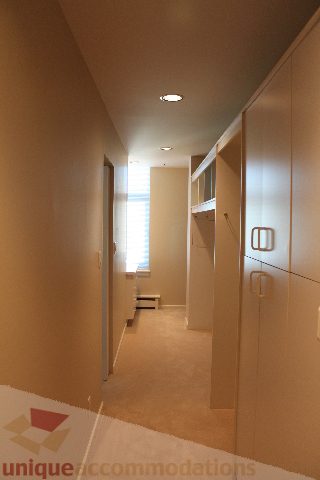 Spacious hallway with built-in storage and carpeted floor. - 900 - 1919 Beach Ave, Vancouver Downtown