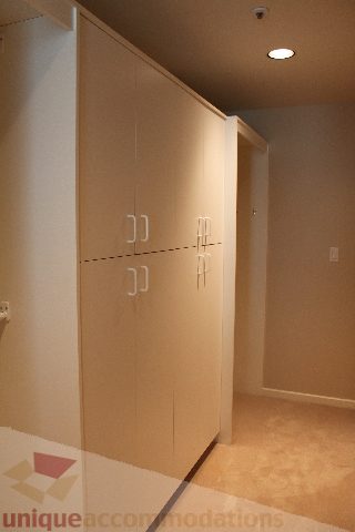 Furnished bedroom with light wood cabinets and carpeted floor. - 900 - 1919 Beach Ave, Vancouver Downtown