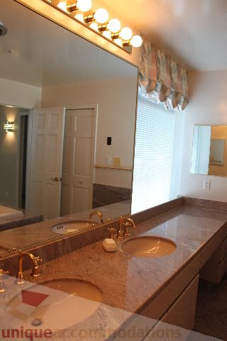 Spacious bathroom with granite countertops and a large mirror. - 900 - 1919 Beach Ave, Vancouver Downtown