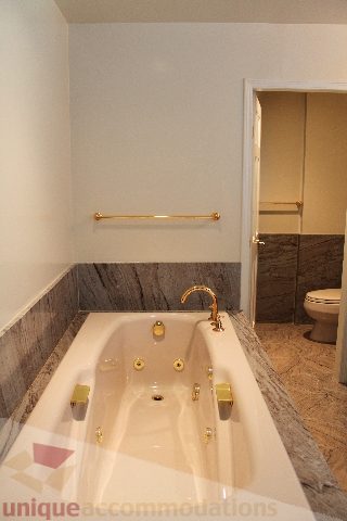 Bathroom with marble accents and gold fixtures. - 900 - 1919 Beach Ave, Vancouver Downtown