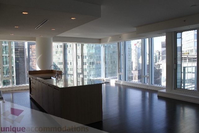 Bright kitchen with hardwood floors and a city view. - 2407 - 1011 West Cordova Street, Vancouver Downtown