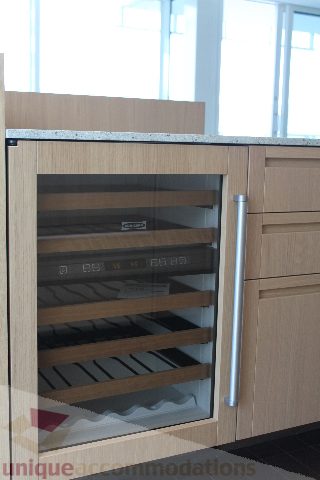 Bright kitchen with granite countertops and built-in wine cooler. - 2407 - 1011 West Cordova Street, Vancouver Downtown