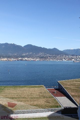 Bright living room with a stunning city view and rooftop access. - 2407 - 1011 West Cordova Street, Vancouver Downtown