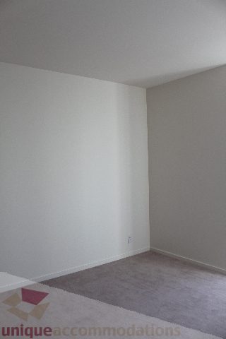 Empty living room with light carpet and white walls. - 2407 - 1011 West Cordova Street, Vancouver Downtown
