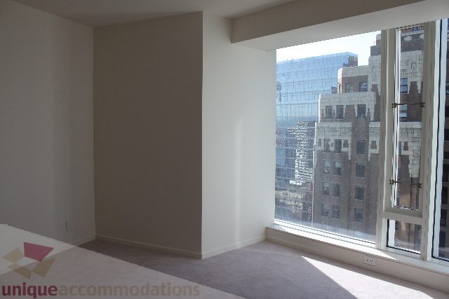 Spacious living room with city view and large windows. - 2407 - 1011 West Cordova Street, Vancouver Downtown