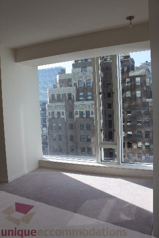 Bright living room with large city view and carpeted floor. - 2407 - 1011 West Cordova Street, Vancouver Downtown