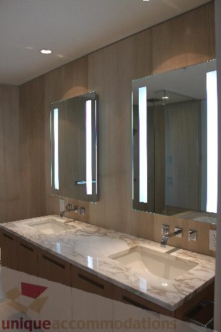 Bathroom with marble countertops and modern lighting fixtures. - 2407 - 1011 West Cordova Street, Vancouver Downtown