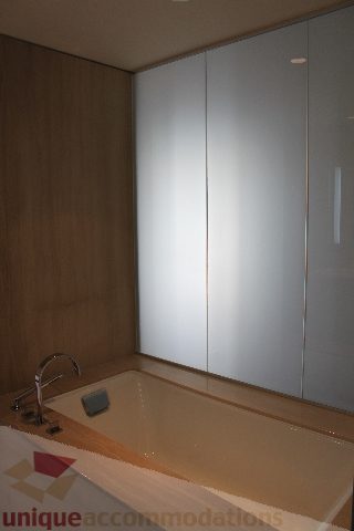 Furnished bathroom with modern sink and large bathtub. - 2407 - 1011 West Cordova Street, Vancouver Downtown