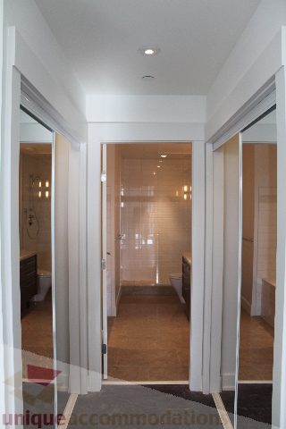 Spacious bathroom with modern shower and sleek fixtures. - 301 - 650 Evergreen Place, North Vancouver