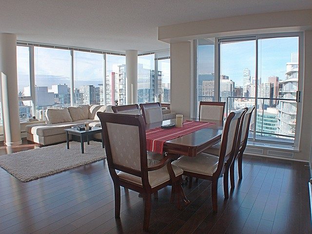 Spacious dining area with hardwood floors and city view. - 3705 - 689 Abbott Street, Vancouver Downtown
