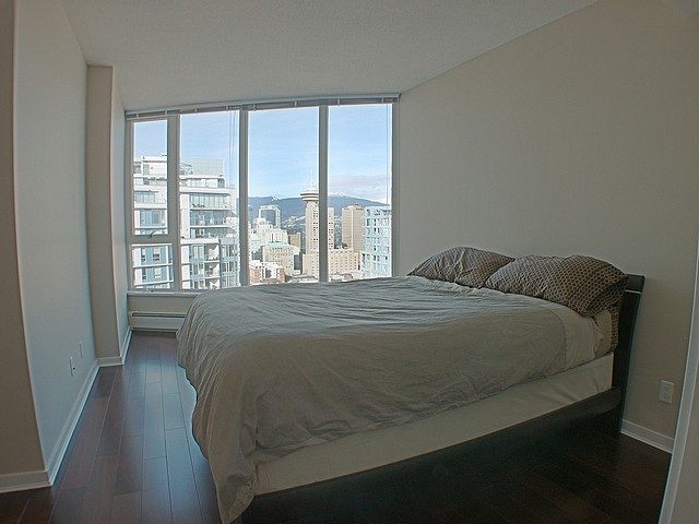 Bright bedroom with hardwood floors and a city view. - 3705 - 689 Abbott Street, Vancouver Downtown
