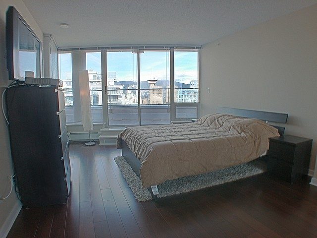 Spacious 3-bedroom condo with hardwood floors, city view, and modern furnishings. - 3705 - 689 Abbott Street, Vancouver Downtown