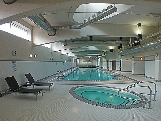 Spacious indoor pool area with modern design and lounge chairs. - 3705 - 689 Abbott Street, Vancouver Downtown