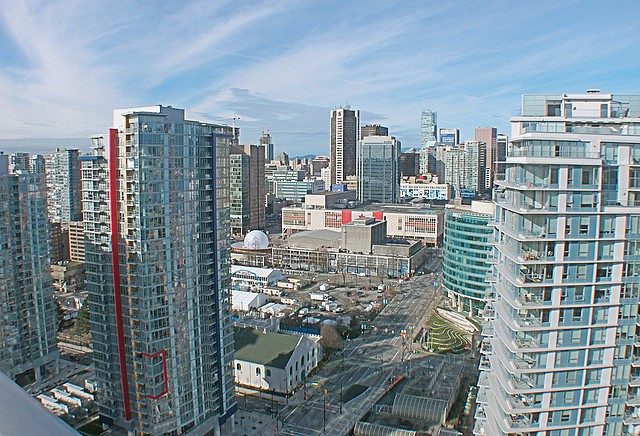Bright living room with city view and modern furnishings. - 3705 - 689 Abbott Street, Vancouver Downtown