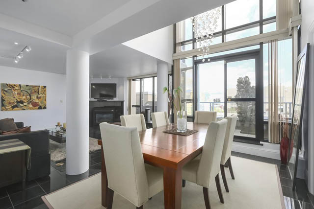 Spacious living room with hardwood floors, city view, and modern decor. - PH6  2806 - 950 Cambie Street, Vancouver Downtown