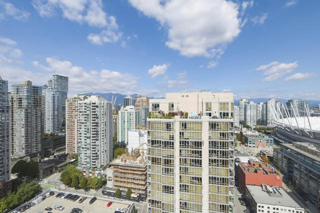 Bright living room with city view and modern furnishings. - PH6  2806 - 950 Cambie Street, Vancouver Downtown
