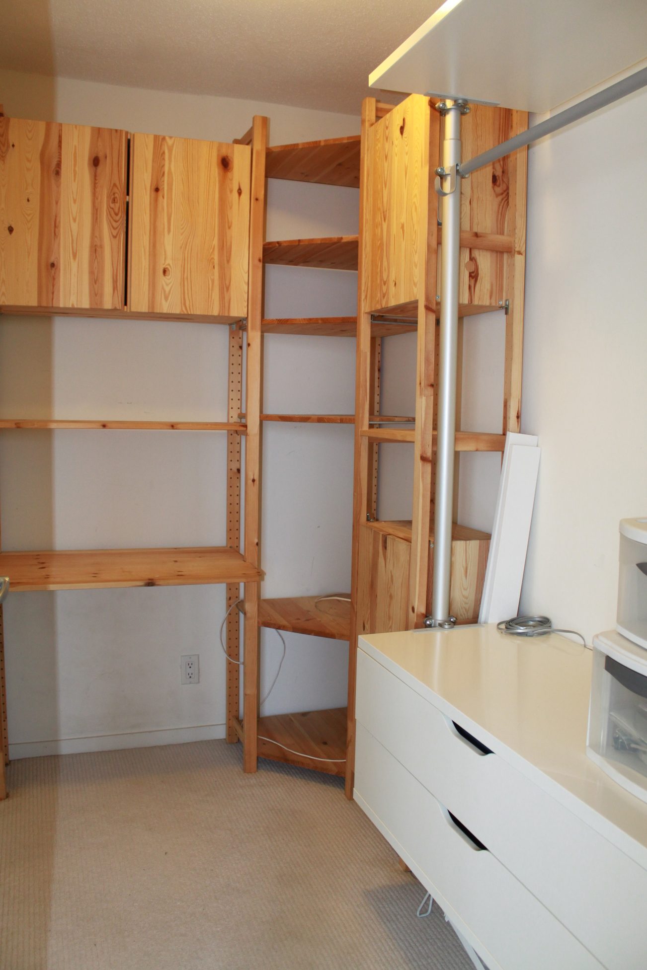 Bright and spacious bedroom with wooden shelving and white countertops. - 2001 - 1199 Seymour, Vancouver Downtown