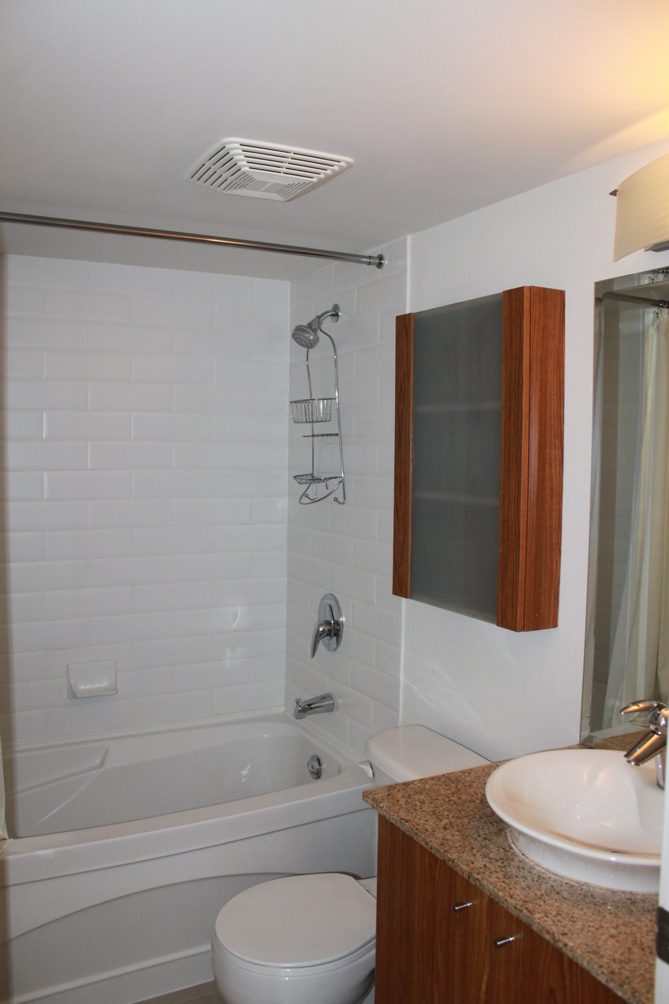 Bright bathroom with granite countertops and wooden accents. - 2001 - 1199 Seymour, Vancouver Downtown