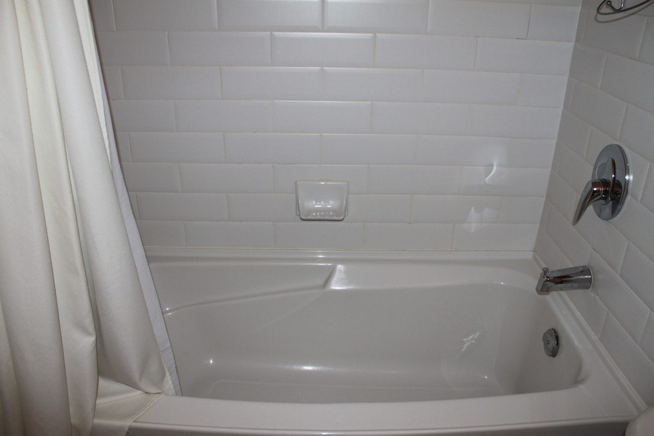 Bathroom with white tile walls and a modern faucet. - 2001 - 1199 Seymour, Vancouver Downtown