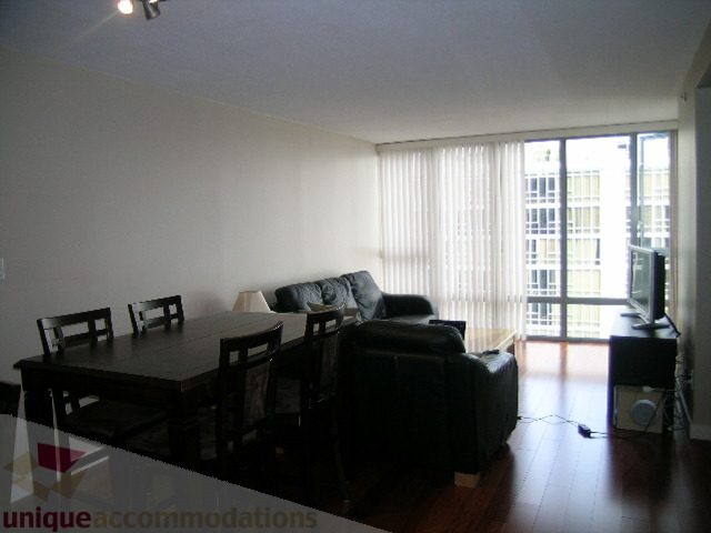 Furnished living room with hardwood floors, city view, and modern decor. - 2507 - 950 Cambie Street, Vancouver Downtown