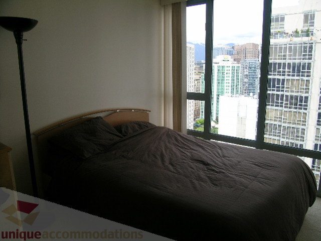 Spacious bedroom with a city view and modern furnishings. - 2507 - 950 Cambie Street, Vancouver Downtown
