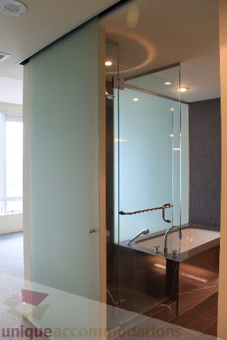 Modern bathroom with glass shower and sleek countertop. - 2205 - 1077 West Cordova, Vancouver Downtown