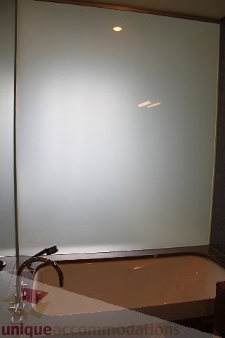 Spacious bathroom with modern bathtub and frosted glass shower. - 2205 - 1077 West Cordova, Vancouver Downtown