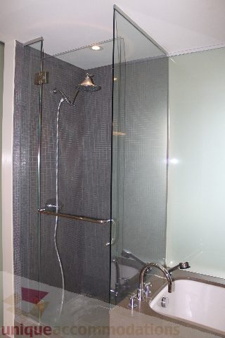 Modern bathroom with sleek glass shower and contemporary sink. - 2205 - 1077 West Cordova, Vancouver Downtown