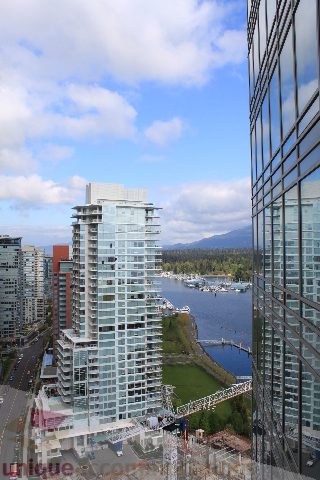 Spacious 1-bedroom condo with stunning city view, featuring modern furnishings and direct access to waterfront.