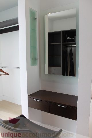 Furnished entryway with sleek countertop and mirrored closet. - 6012 Newton Wynd, Vancouver West Side