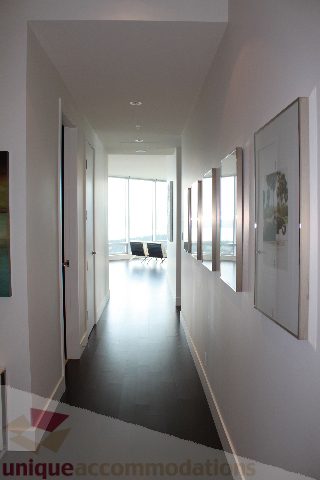 Furnished hallway leading to living area with city view and modern decor. - 6002 - 1128 West Georgia, Vancouver Downtown