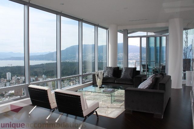 Spacious living room with panoramic city view and modern furnishings. - 6002 - 1128 West Georgia, Vancouver Downtown