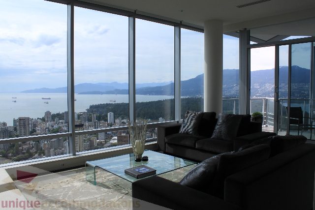 Furnished living room with panoramic city view and large windows. - 6002 - 1128 West Georgia, Vancouver Downtown