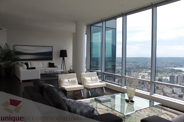 Spacious living room with a city view and modern furnishings. - 6002 - 1128 West Georgia, Vancouver Downtown