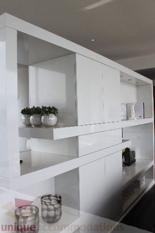 Furnished living room with sleek white shelves and modern decor. - 6002 - 1128 West Georgia, Vancouver Downtown