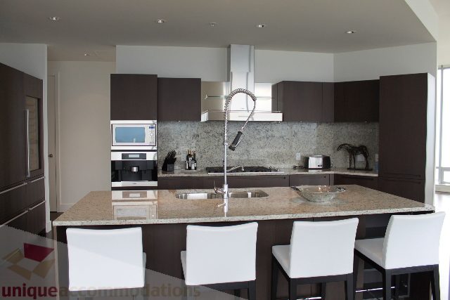 Furnished kitchen with granite countertops and modern appliances. - 6002 - 1128 West Georgia, Vancouver Downtown