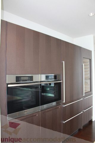 Bright kitchen with modern appliances and sleek cabinetry. - 6002 - 1128 West Georgia, Vancouver Downtown