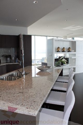 Bright kitchen with granite countertops, modern faucet, and city view. - 6002 - 1128 West Georgia, Vancouver Downtown